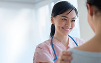Nurse comforting patient