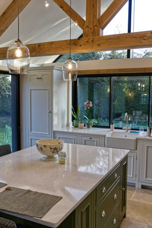 Contemporary kitchen design with wooden beams and island counter