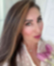 Mary Ciancibello wearing a gold evil eye necklace by Rose Garden Jewelry