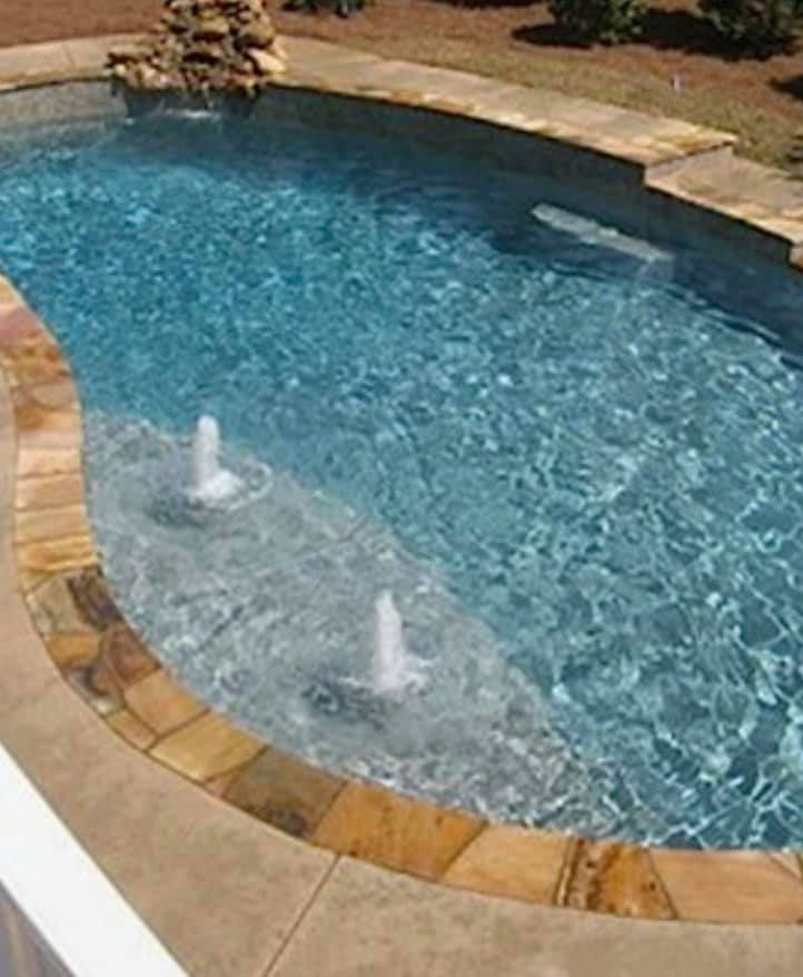 rounded pool with jets in shallow end.jpg