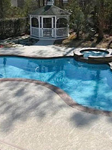 rounded pool with spa and gazebo.jpg