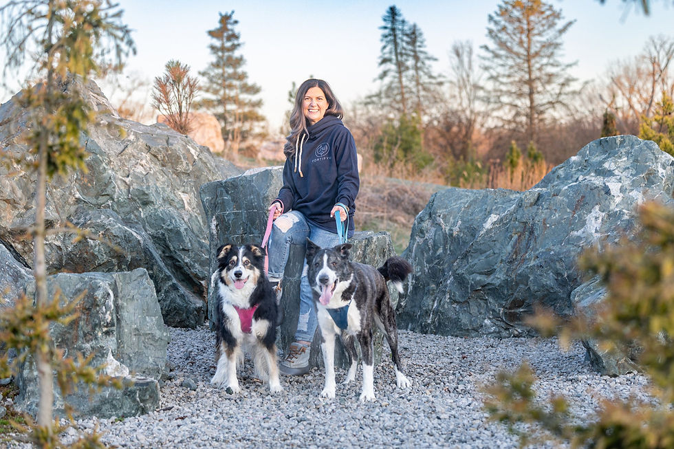 Dr. McNally with her two dogs, Bailey and Cooper