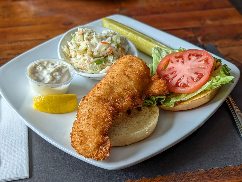 Mussels seafood pasta in red sauce in white bowl with garlic bowl, eli fish brewing company draft beer