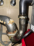 Corroded P-trap plumbing pipe