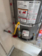 Water heater installation with gas lines for plumbing.