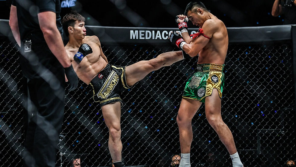 High angle view of Tawanchai delivering a powerful teep kick