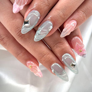 Iridescent chrome nails with 3D floral and gemstone accents from Robson Nails & Spa in downtown Vancouver.