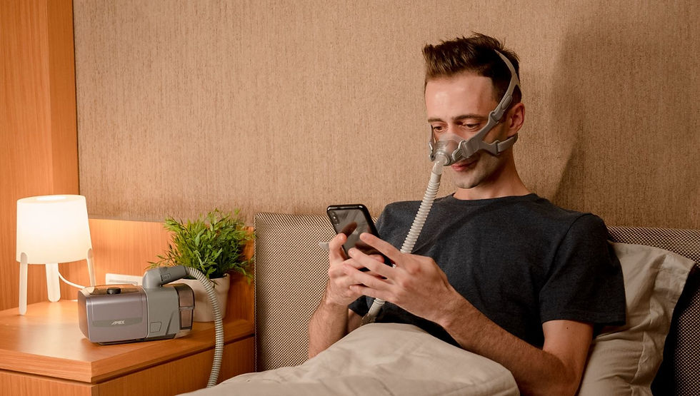 Image of a man using a CPAP machine