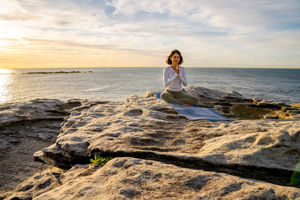 Daniella-Goldberg-PHD-Second-Spring-member-in-a-yoga-breathwork-pose-for-menopause-on-the-