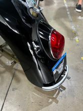 Back view of black custom pit bike.