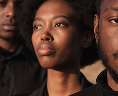 group of three people posing