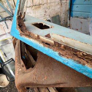 Rusty frame on VW Bus before restoration.