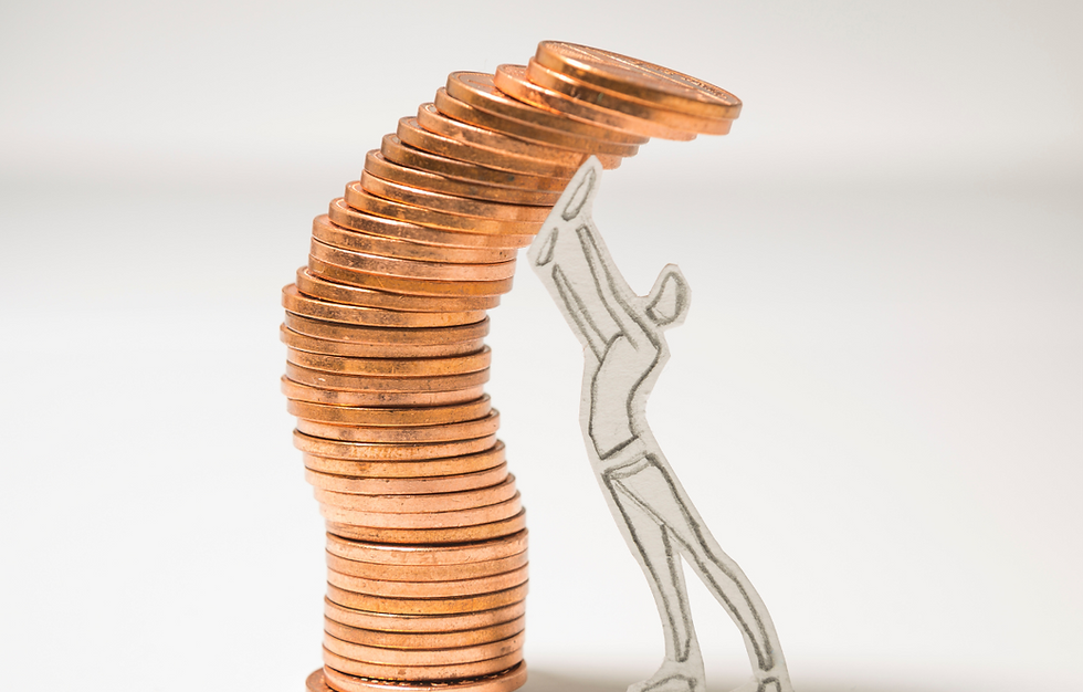 Cutout figure pushes a leaning stack of copper coins against a white background, conveying struggle and balance.