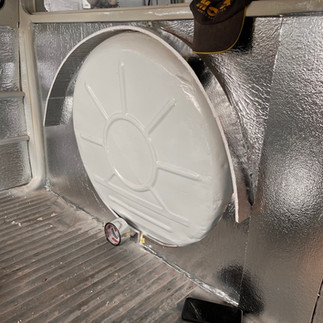 Freshly painted auto body parts.( wheel storage)