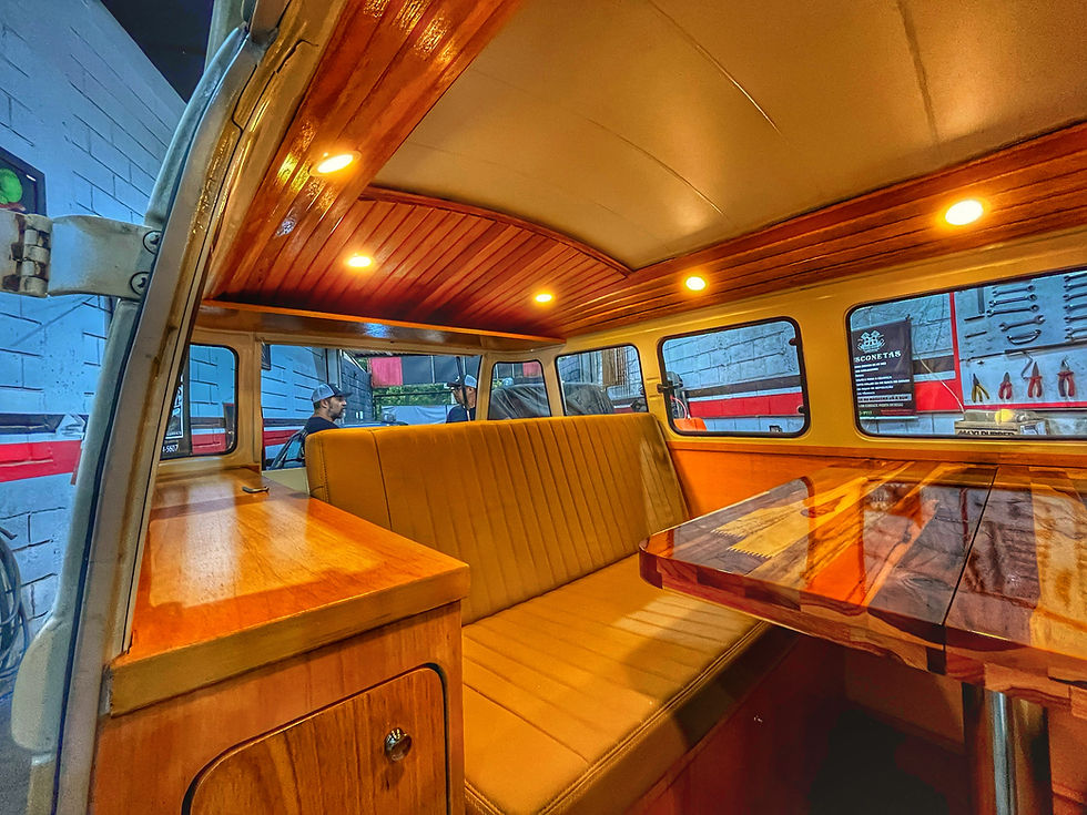 beach bus custom interior with wood paneling and lights.