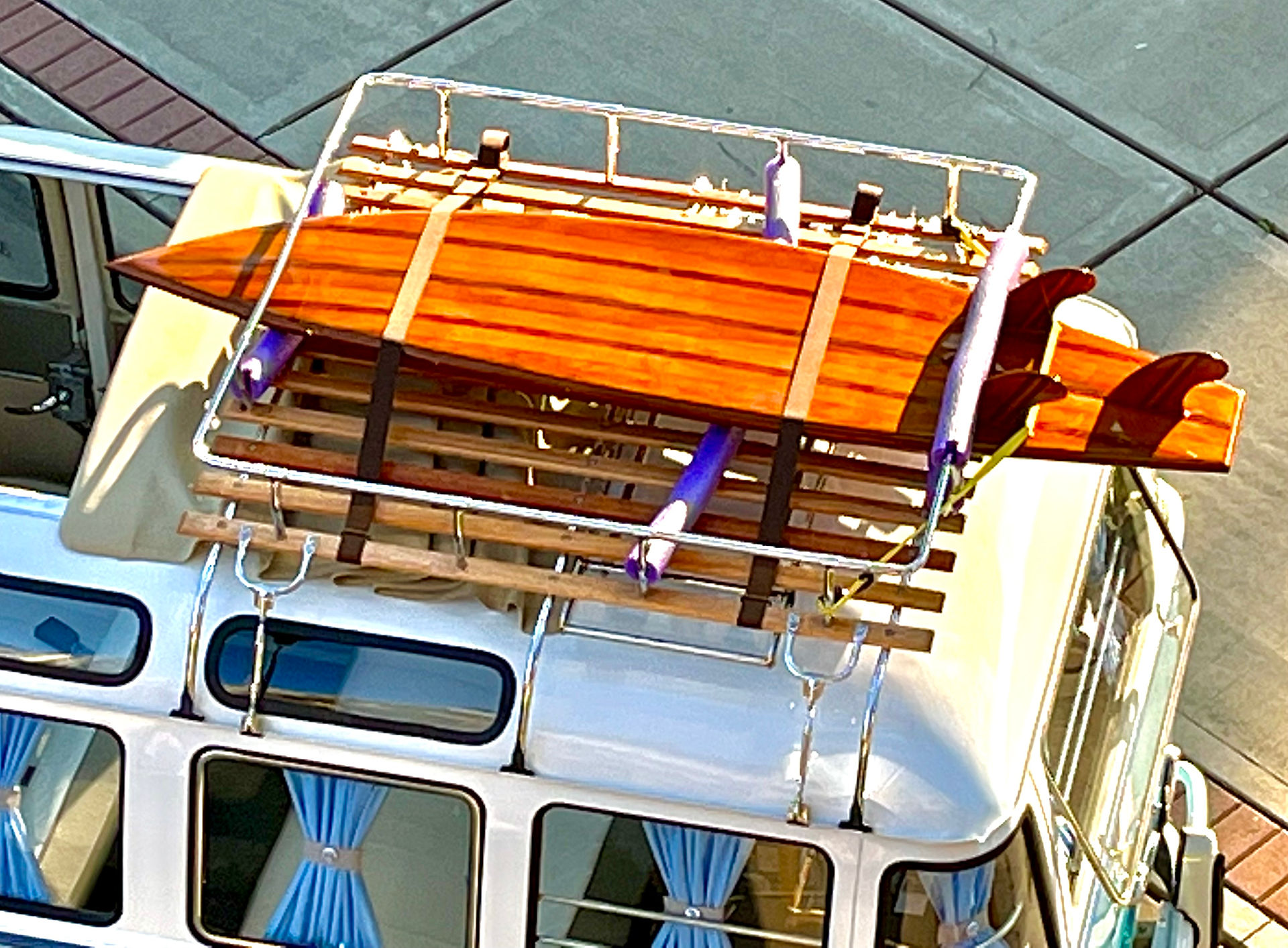 roof rack and surfboard on top of 1964 Samba bus