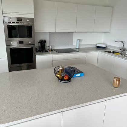 Modern fitted kitchen with white cabinets and island