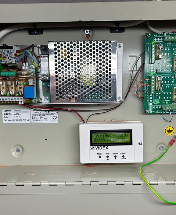 Home security alarm mounted on side of building
