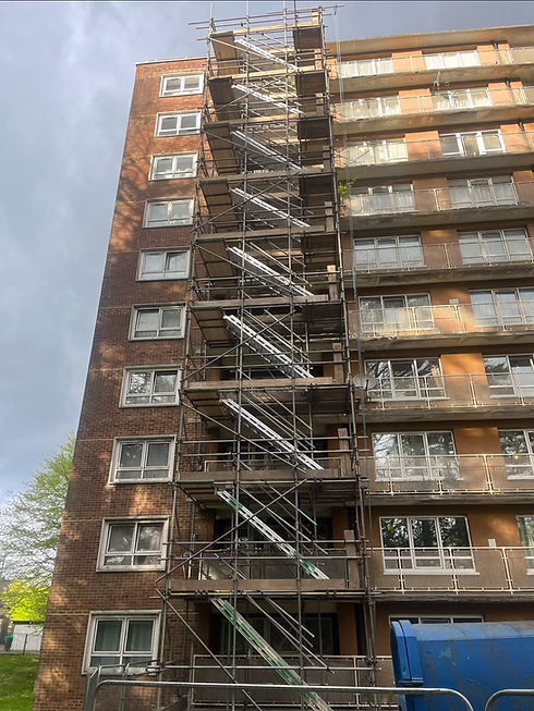 Scaffolding, scaling a tall tower block of flats