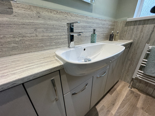 Bathroom vanity with sink, chrome faucet, stone countertop