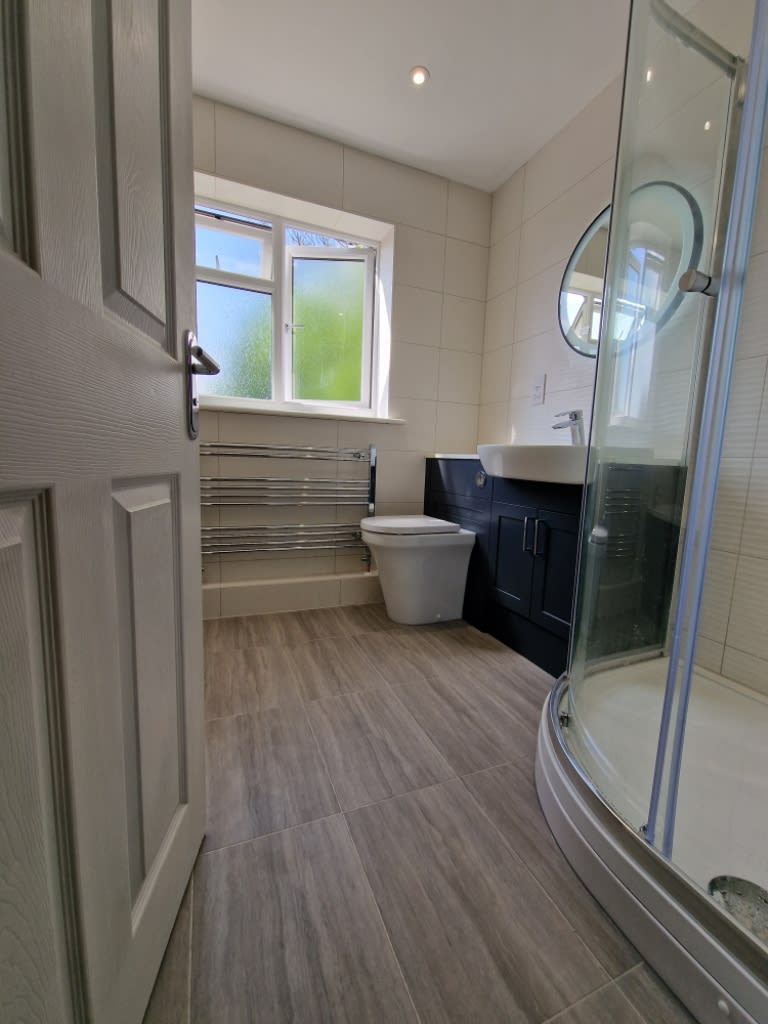 Modern dark-blue bathroom refurbishment