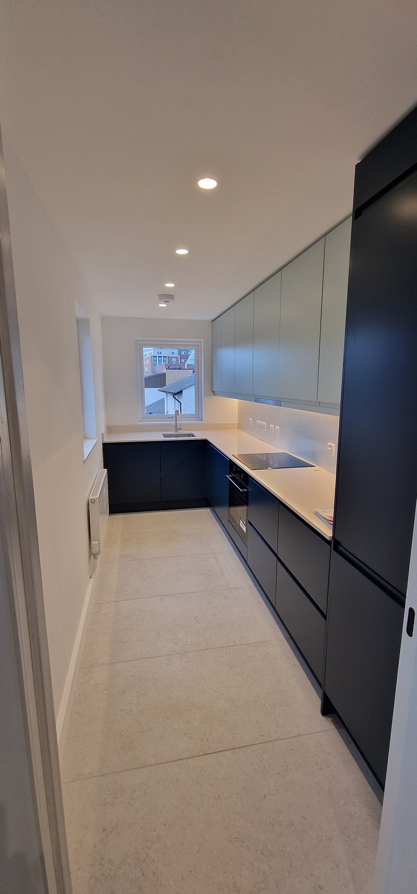 Bespoke kitchen with dark blue cabinets