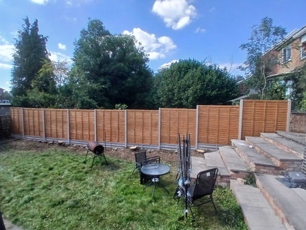 Brown wooden fence installed in back garden by TDax