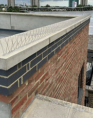 Spiked pest control on the top of a wall, to stop pidgeons