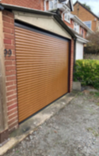 Brown garage door, newly installed by the guys at Rutland Garage Doors