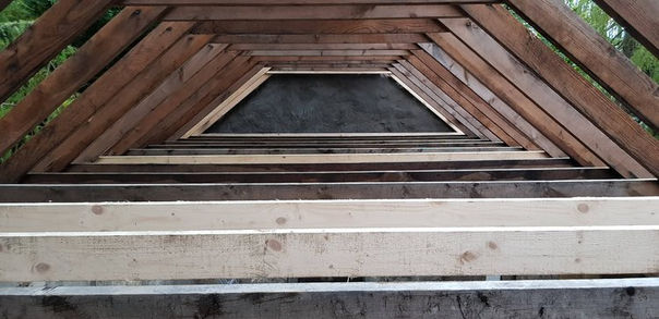 Interior view of all the new wooden support beams installed in an old bothy