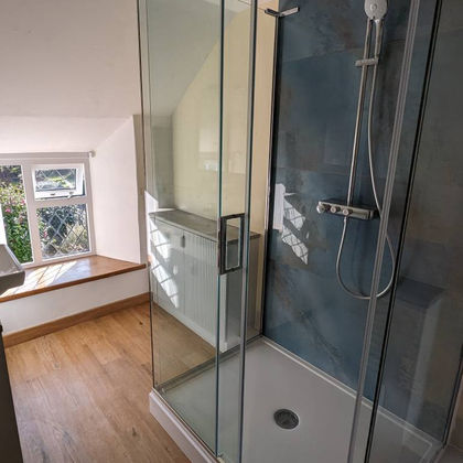 Modern bathroom with glass shower and window