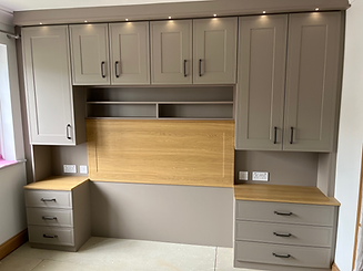 Light gray fitted wardrobe with desk and drawers