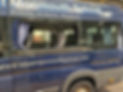 The broken side window of a minivan, used mainly by a school in Monmouth