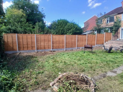 Brown wooden fence installed in back garden by TDax