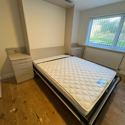 Bespoke wall bed with integrated storage cabinets