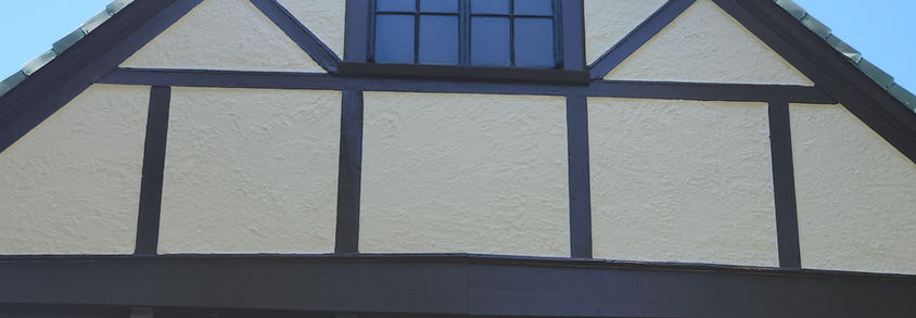 Tudor-style house exterior with dark trim