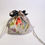 Thumbnail: The other side of the drawstring pouch, showing orange, blue, purple flowers and a little green leaves.