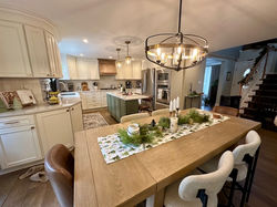 All new flooring, countertops, painted cabinets with new moldings, new range and hood, and lighting