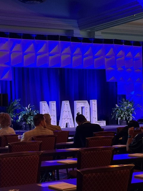 Eye-level view of a modern dental lab workstation with digital equipment