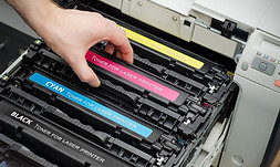 Man-puts-toner-in-the-printer.jpg