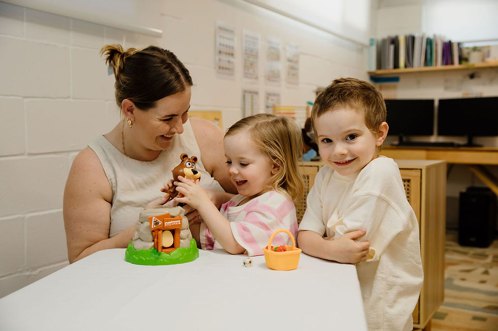 Speech pathologist playing 'Beware the Bear' with 2 children