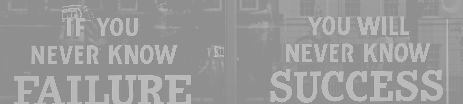 Motivational sign in the window of a box