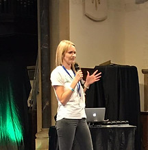 Woman giving presentation, microphone in hand
