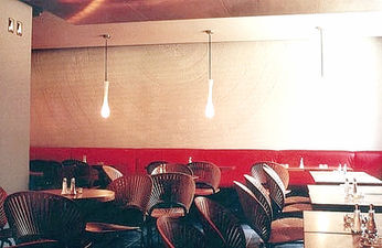 Café Restaurant ATLAS in Munich, designed by architects Suzanne Faltenbacher and Klaus Neumann. The corporate design was also conceived and implemented by studioacht. Artistic wall work in plaster technique by Suzanne Faltenbacher.