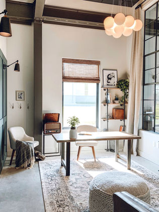 a rustic industrial office with mid century modern fixtures and furniture