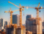 construction-cranes-dominating-cityscape.jpg