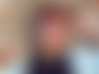 a woman in a black top smiling. 