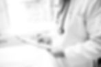 Physician B&W writing on notepad