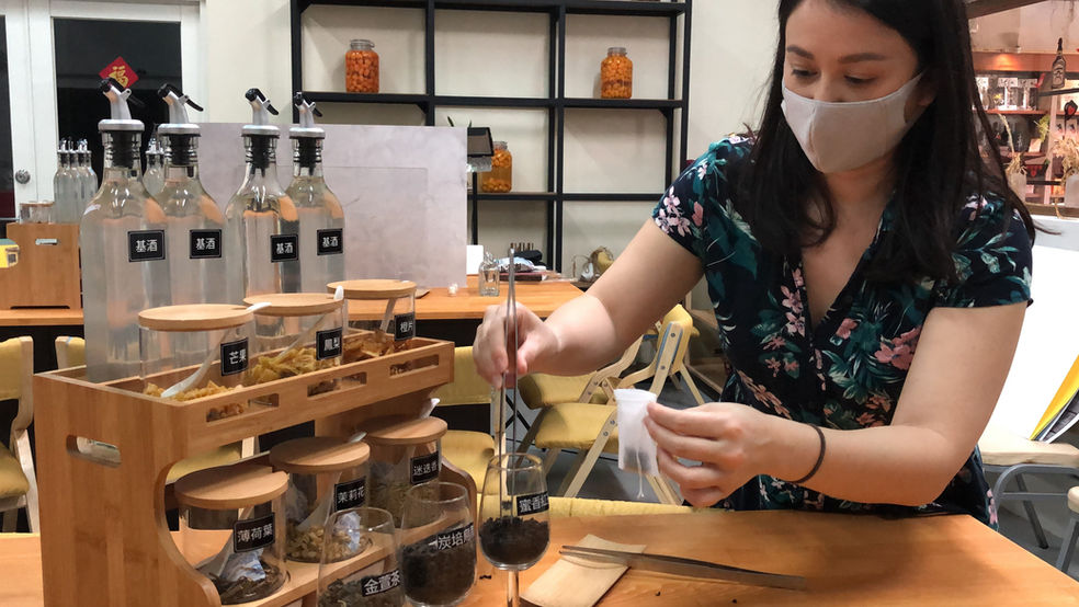 Making tea-infused liquor at Cangjiu Winery in Yilan, Taiwan.