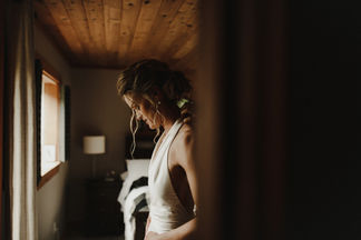 A+C's west coast island wedding at Bilston Creek Farm was a stunning celebration that embraced the moody atmosphere of the surroundings in all the right ways. With dramatic rain and a lush forest as their backdrop, the couple took full advantage of the picturesque property, resulting in breathtaking photos that captured the essence of their special day. Their outdoor ceremony was held beneath a magnificent tree, creating a magical setting that was both intimate and enchanting. The reception, located in The Barn, was designed with simplicity and elegance in mind, featuring rustic wooden tables, stylish black metal chairs, and beautiful fresh evergreens, all working together to enhance the natural beauty of the venue.